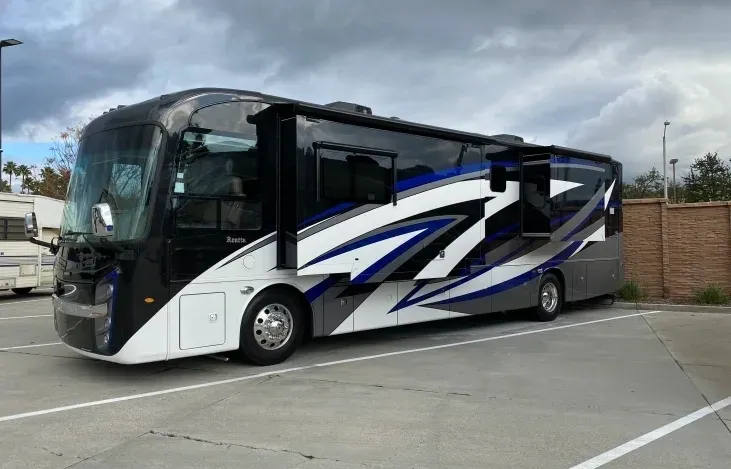 A large bus is parked on the side of the road.